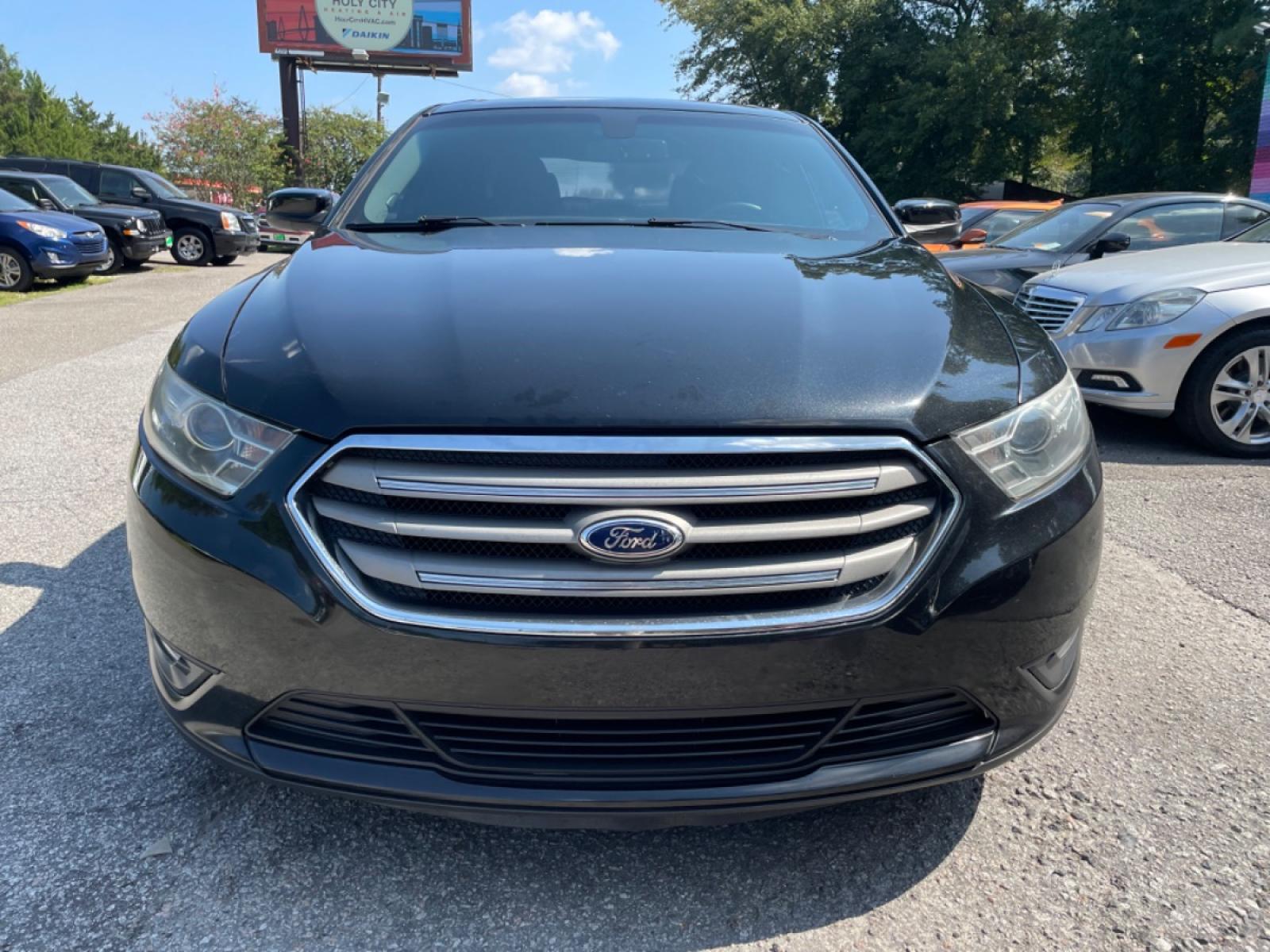 2014 BLACK FORD TAURUS SEL (1FAHP2E89EG) with an 3.5L engine, Automatic transmission, located at 5103 Dorchester Rd., Charleston, SC, 29418-5607, (843) 767-1122, 36.245171, -115.228050 - Photo #1