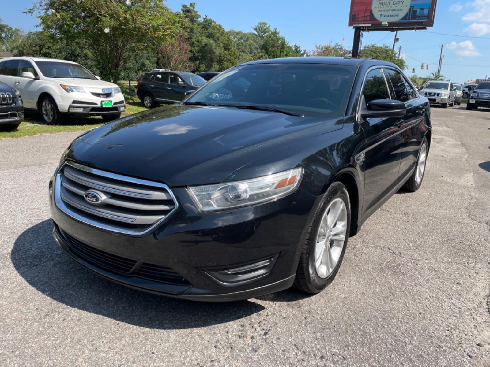2014 BLACK FORD TAURUS SEL (1FAHP2E89EG) with an 3.5L engine, Automatic transmission, located at 5103 Dorchester Rd., Charleston, SC, 29418-5607, (843) 767-1122, 36.245171, -115.228050 - Photo #2