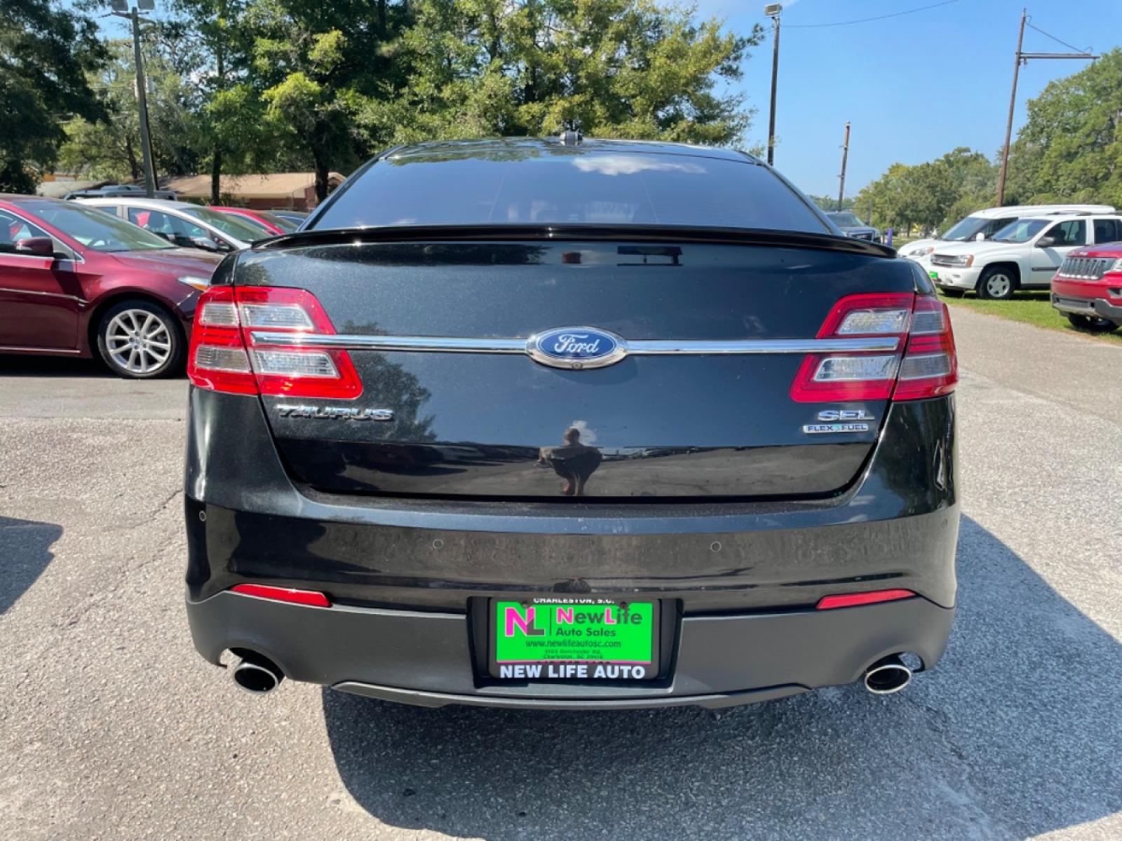 2014 BLACK FORD TAURUS SEL (1FAHP2E89EG) with an 3.5L engine, Automatic transmission, located at 5103 Dorchester Rd., Charleston, SC, 29418-5607, (843) 767-1122, 36.245171, -115.228050 - Photo #5