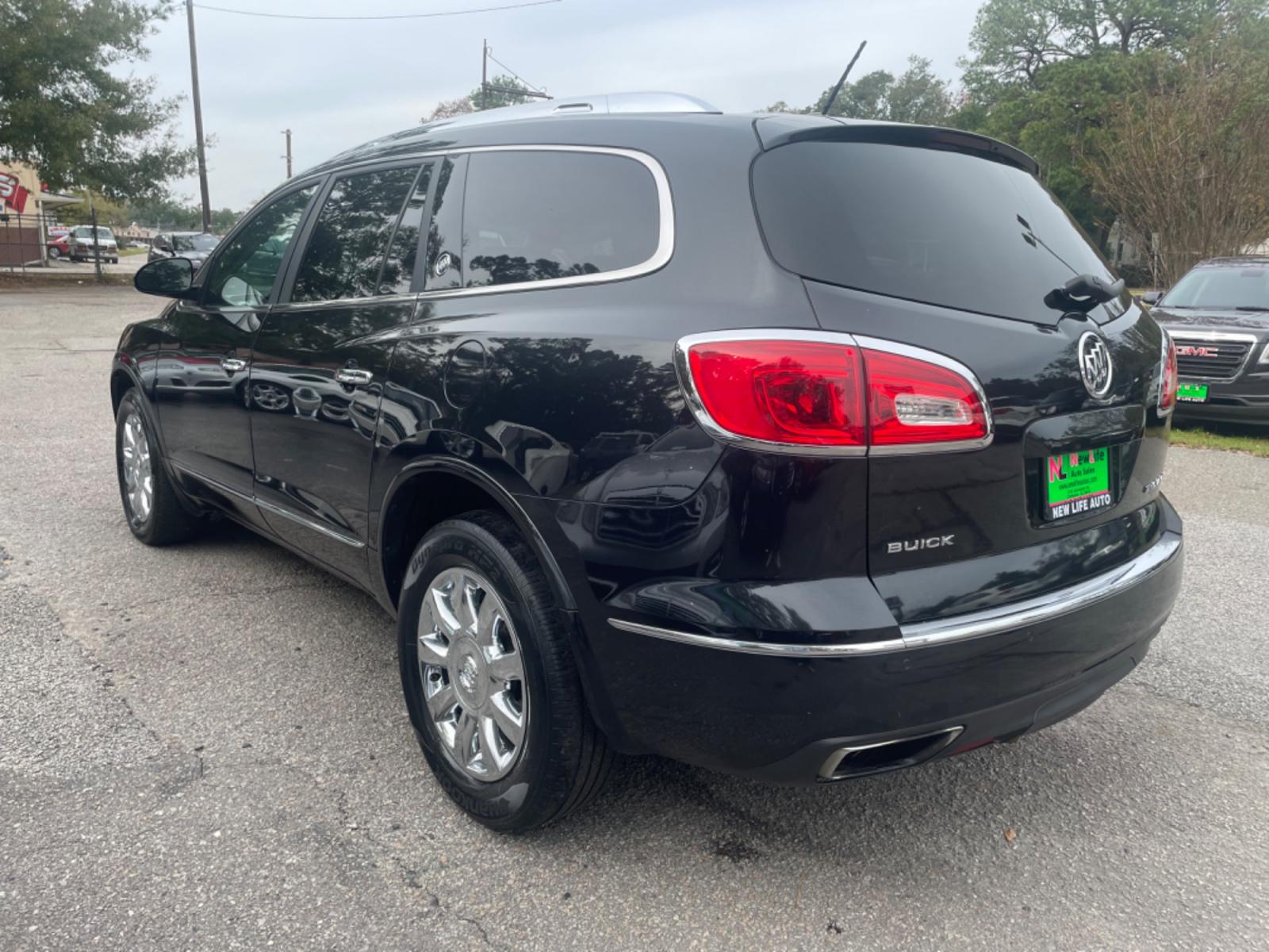 2014 BLACK BUICK ENCLAVE (5GAKRBKD4EJ) with an 3.6L engine, Automatic transmission, located at 5103 Dorchester Rd., Charleston, SC, 29418-5607, (843) 767-1122, 36.245171, -115.228050 - Leather interior with Navigation, Backup Camera, Bose Stereo with CD/AUX/Sat/Bluetooth, Dual Climate Control, Power Everything (windows, locks, seats, mirrors), Heated/Memory Seating, Rear Climate Control, Power Liftgate, 3rd Row with Middle Captains Row, Keyless Entry, Chrome Wheels. Clean CarFax ( - Photo #4
