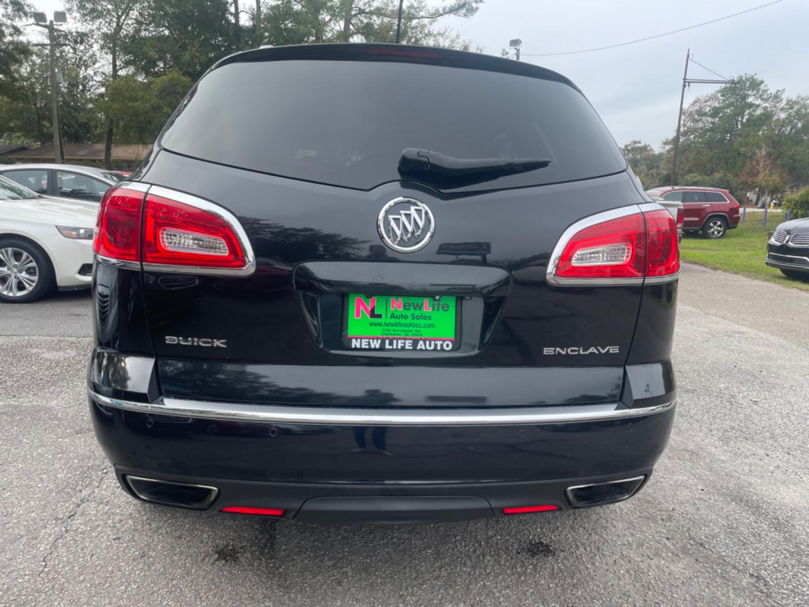 2014 BLACK BUICK ENCLAVE (5GAKRBKD4EJ) with an 3.6L engine, Automatic transmission, located at 5103 Dorchester Rd., Charleston, SC, 29418-5607, (843) 767-1122, 36.245171, -115.228050 - Leather interior with Navigation, Backup Camera, Bose Stereo with CD/AUX/Sat/Bluetooth, Dual Climate Control, Power Everything (windows, locks, seats, mirrors), Heated/Memory Seating, Rear Climate Control, Power Liftgate, 3rd Row with Middle Captains Row, Keyless Entry, Chrome Wheels. Clean CarFax ( - Photo #5