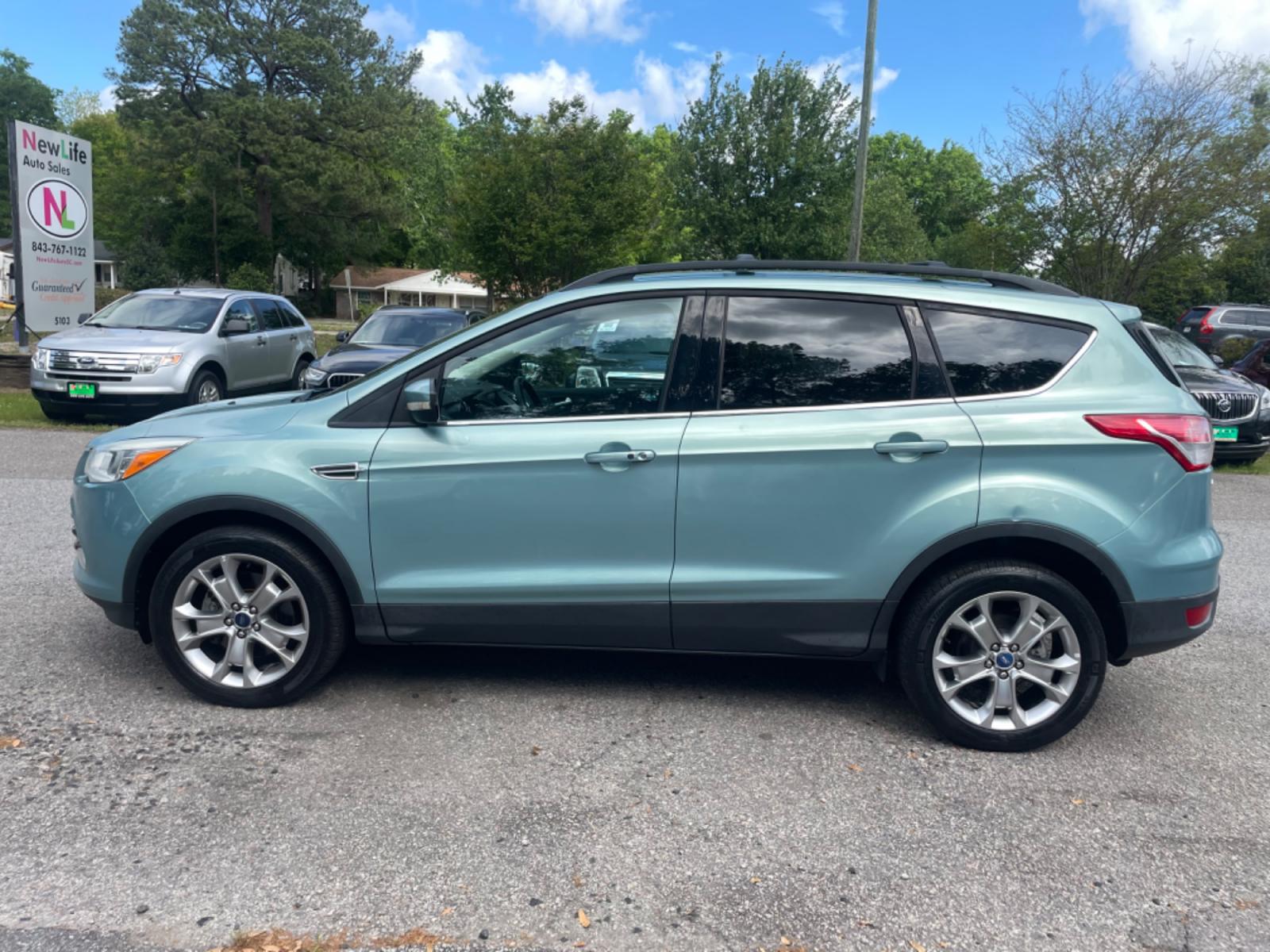 2013 BLUE FORD ESCAPE SEL (1FMCU9HX0DU) with an 1.6L engine, Automatic transmission, located at 5103 Dorchester Rd., Charleston, SC, 29418-5607, (843) 767-1122, 36.245171, -115.228050 - Clean CarFax (no accidents reported!) Clean interior with Leather, CD/USB/Sat/Bluetooth, Power Everything (windows, locks, seat, mirrors), Power Liftgate, Heated/Memory Seating, Push Button Start, Keyless Entry, Alloy Wheels. Certified One Owner!! Only 109k miles! Located at New Life Auto Sales! 2 - Photo #2