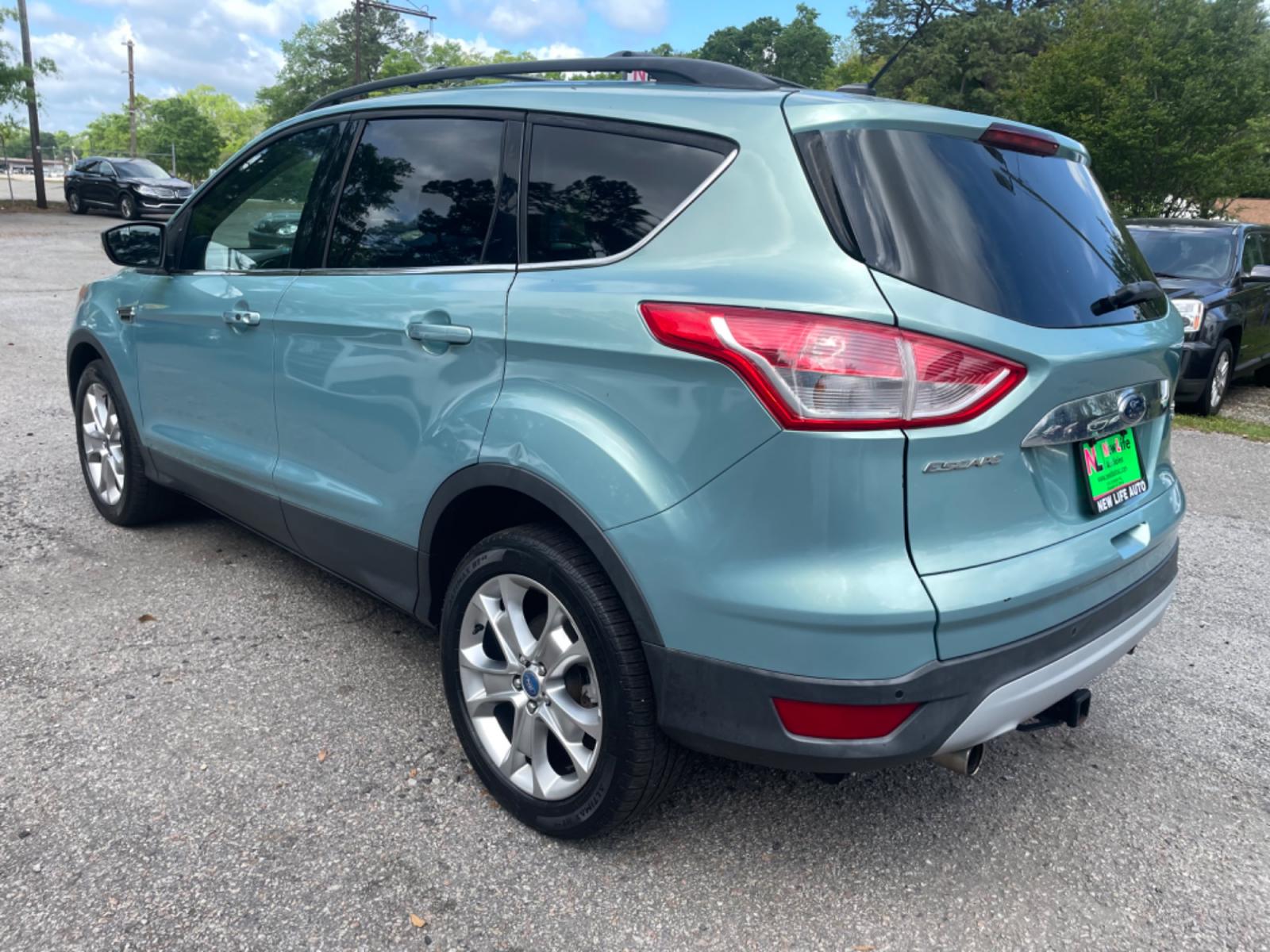2013 BLUE FORD ESCAPE SEL (1FMCU9HX0DU) with an 1.6L engine, Automatic transmission, located at 5103 Dorchester Rd., Charleston, SC, 29418-5607, (843) 767-1122, 36.245171, -115.228050 - Clean CarFax (no accidents reported!) Clean interior with Leather, CD/USB/Sat/Bluetooth, Power Everything (windows, locks, seat, mirrors), Power Liftgate, Heated/Memory Seating, Push Button Start, Keyless Entry, Alloy Wheels. Certified One Owner!! Only 109k miles! Located at New Life Auto Sales! 2 - Photo #4