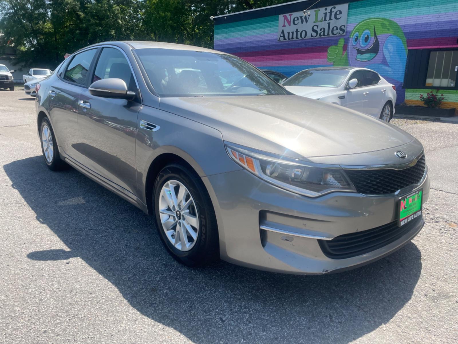 2016 GRAY KIA OPTIMA LX (5XXGT4L32GG) with an 2.4L engine, Automatic transmission, located at 5103 Dorchester Rd., Charleston, SC, 29418-5607, (843) 767-1122, 36.245171, -115.228050 - Photo #0