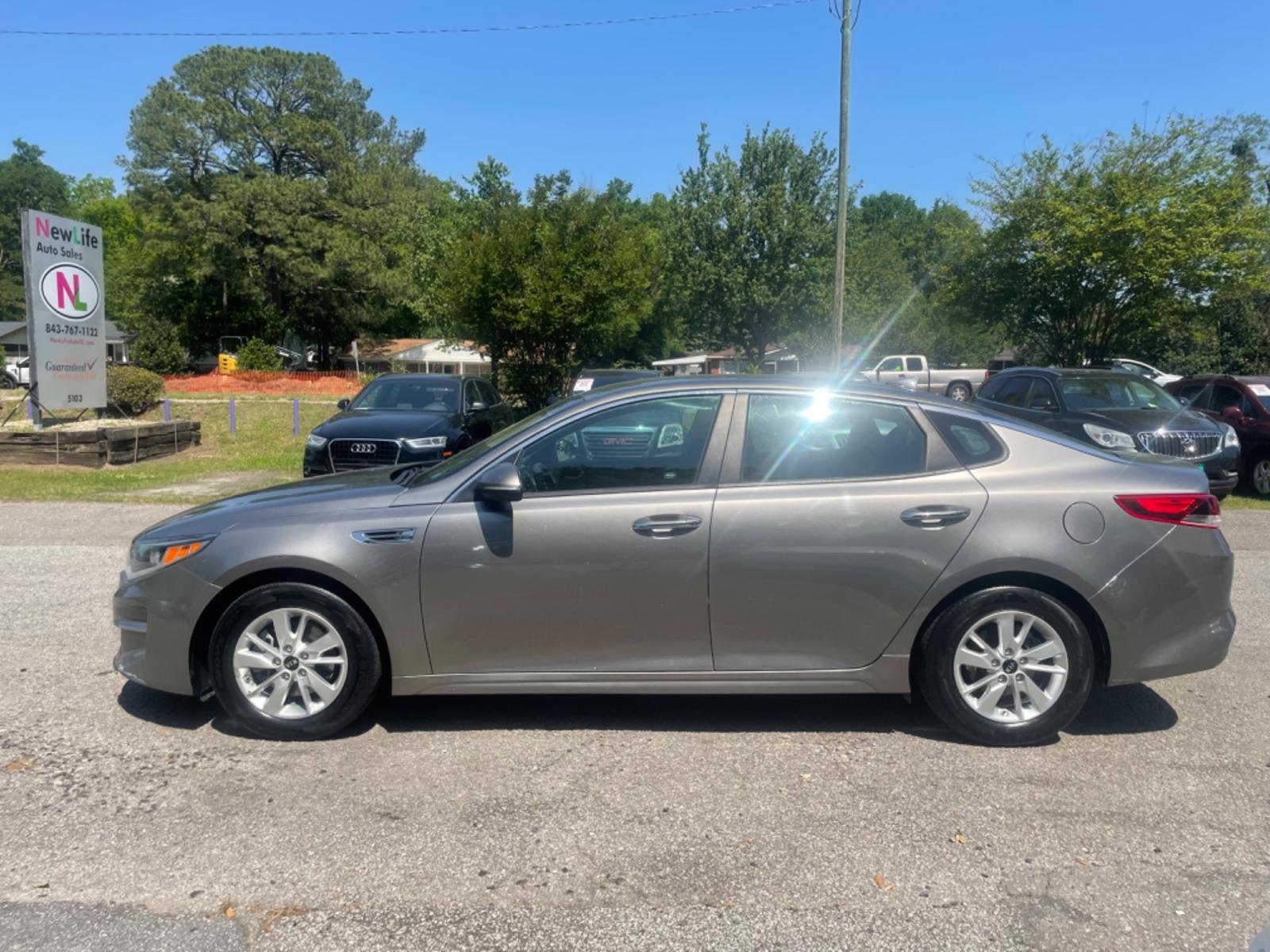 2016 GRAY KIA OPTIMA LX (5XXGT4L32GG) with an 2.4L engine, Automatic transmission, located at 5103 Dorchester Rd., Charleston, SC, 29418-5607, (843) 767-1122, 36.245171, -115.228050 - Local Trade-in with CD/AUX/Sat/Bluetooth, Power Windows, Power Locks, Power Mirrors, Backup Camera, Keyless Entry, Alloy Wheels. Clean CarFax (no accidents reported!) 128k miles Located at New Life Auto Sales! 2018-2023 Top 5 Finalist for Charleston City Paper's BEST PLACE TO BUY A USED CAR! 5103 D - Photo #3