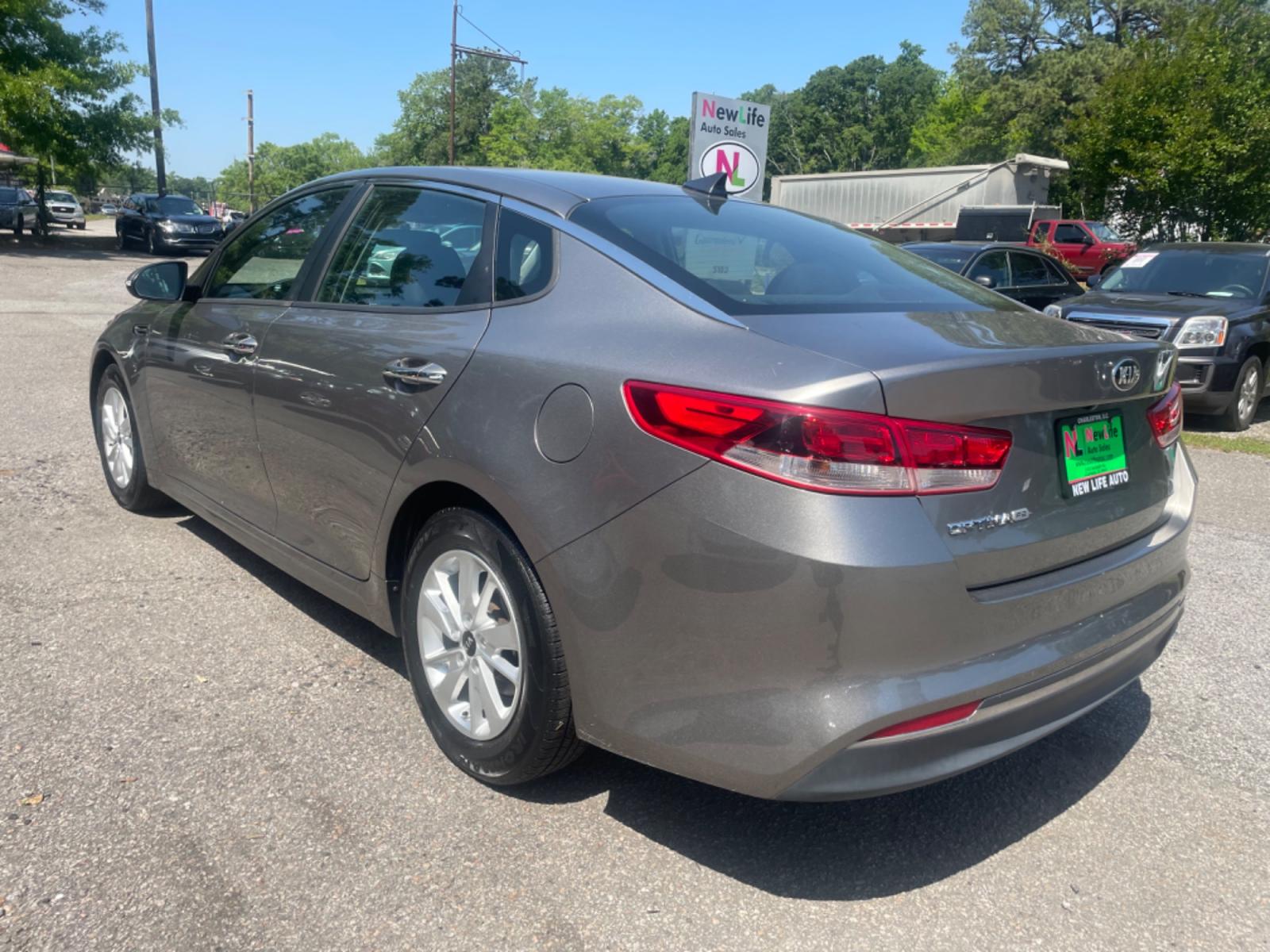 2016 GRAY KIA OPTIMA LX (5XXGT4L32GG) with an 2.4L engine, Automatic transmission, located at 5103 Dorchester Rd., Charleston, SC, 29418-5607, (843) 767-1122, 36.245171, -115.228050 - Local Trade-in with CD/AUX/Sat/Bluetooth, Power Windows, Power Locks, Power Mirrors, Backup Camera, Keyless Entry, Alloy Wheels. Clean CarFax (no accidents reported!) 128k miles Located at New Life Auto Sales! 2018-2023 Top 5 Finalist for Charleston City Paper's BEST PLACE TO BUY A USED CAR! 5103 D - Photo #4