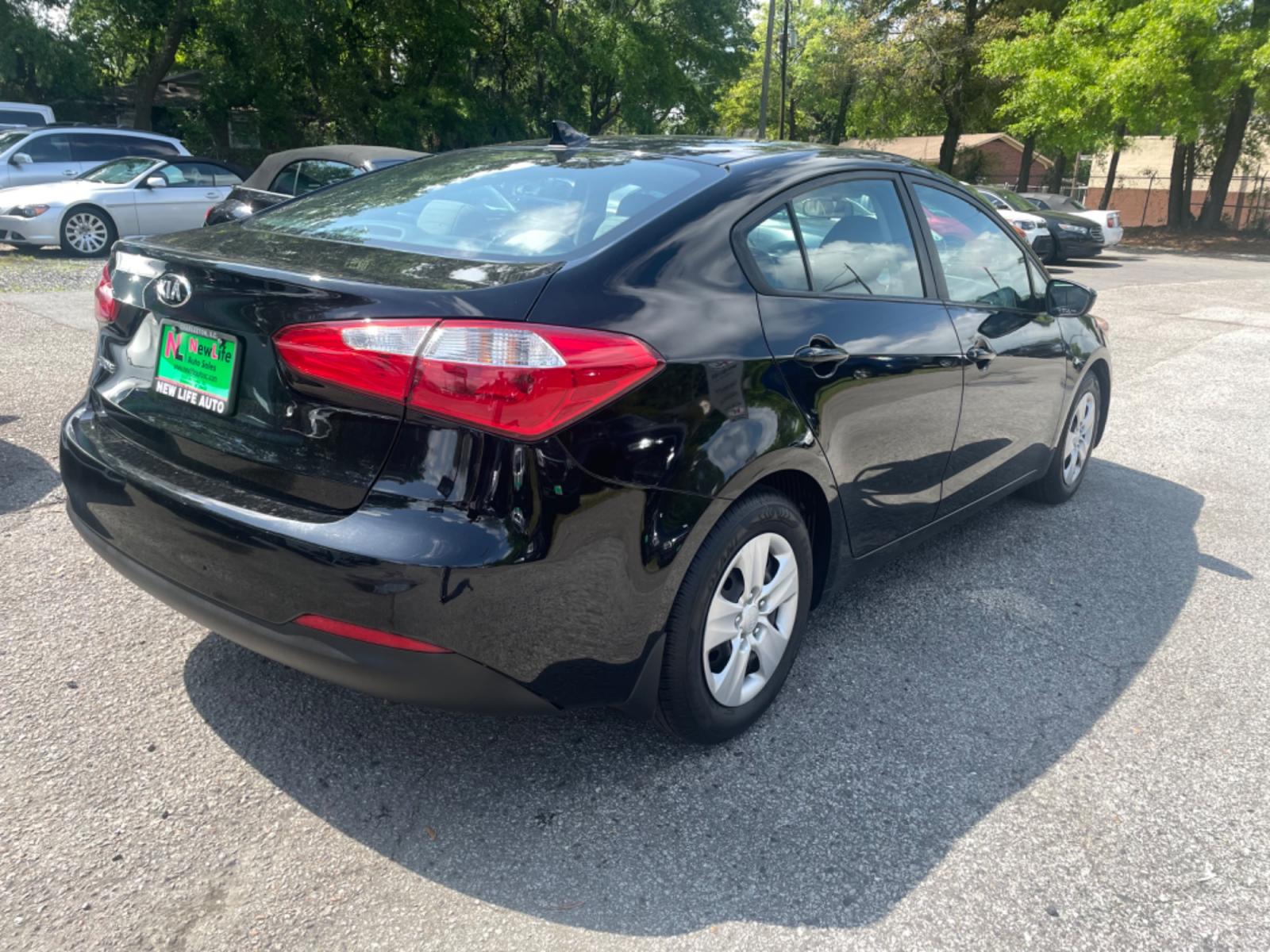 2015 BLACK KIA FORTE LX (KNAFK4A63F5) with an 1.8L engine, Automatic transmission, located at 5103 Dorchester Rd., Charleston, SC, 29418-5607, (843) 767-1122, 36.245171, -115.228050 - Clean interior with CD/AUX/USB/Sat/Bluetooth, Power Windows, Power Locks, Power Mirrors, Keyless Entry. Clean CarFax (no accidents reported!) 121k miles Located at New Life Auto Sales! 2018-2023 Top 5 Finalist for Charleston City Paper's BEST PLACE TO BUY A USED CAR! 5103 Dorchester Road, North Cha - Photo #5