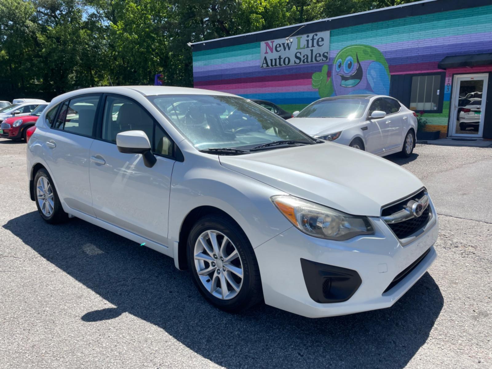 2012 WHITE SUBARU IMPREZA PREMIUM (JF1GPAB67CH) with an 2.0L engine, Continuously Variable transmission, located at 5103 Dorchester Rd., Charleston, SC, 29418-5607, (843) 767-1122, 36.245171, -115.228050 - Photo #0