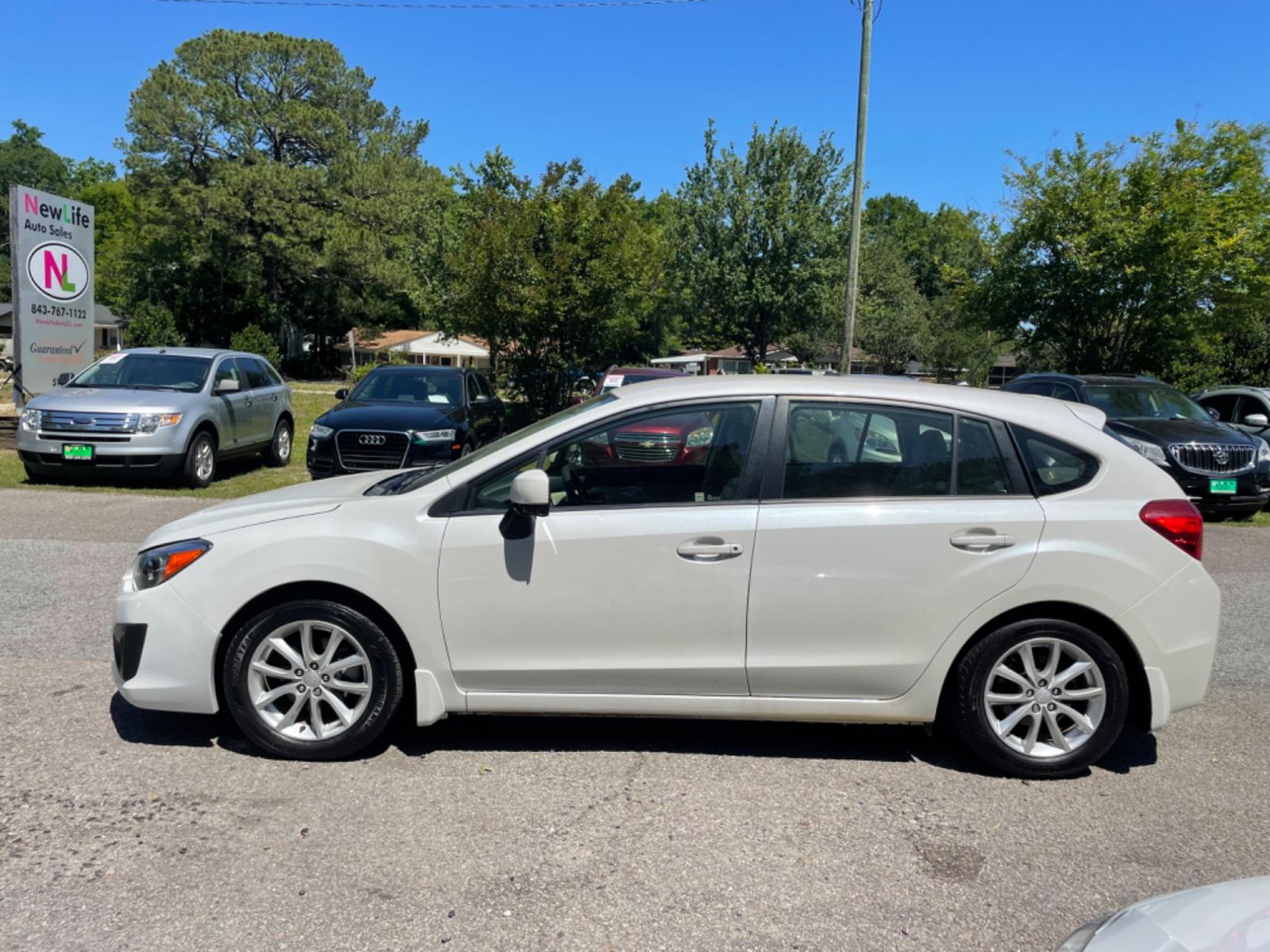 2012 WHITE SUBARU IMPREZA PREMIUM (JF1GPAB67CH) with an 2.0L engine, Continuously Variable transmission, located at 5103 Dorchester Rd., Charleston, SC, 29418-5607, (843) 767-1122, 36.245171, -115.228050 - Photo #3