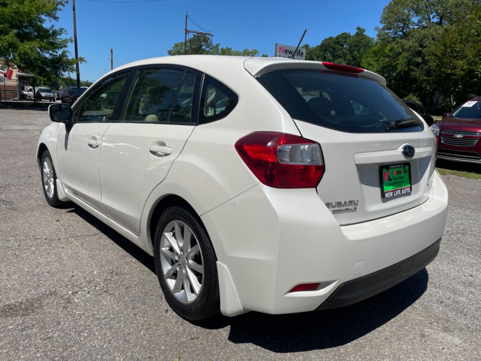 2012 WHITE SUBARU IMPREZA PREMIUM (JF1GPAB67CH) with an 2.0L engine, Continuously Variable transmission, located at 5103 Dorchester Rd., Charleston, SC, 29418-5607, (843) 767-1122, 36.245171, -115.228050 - Photo #4
