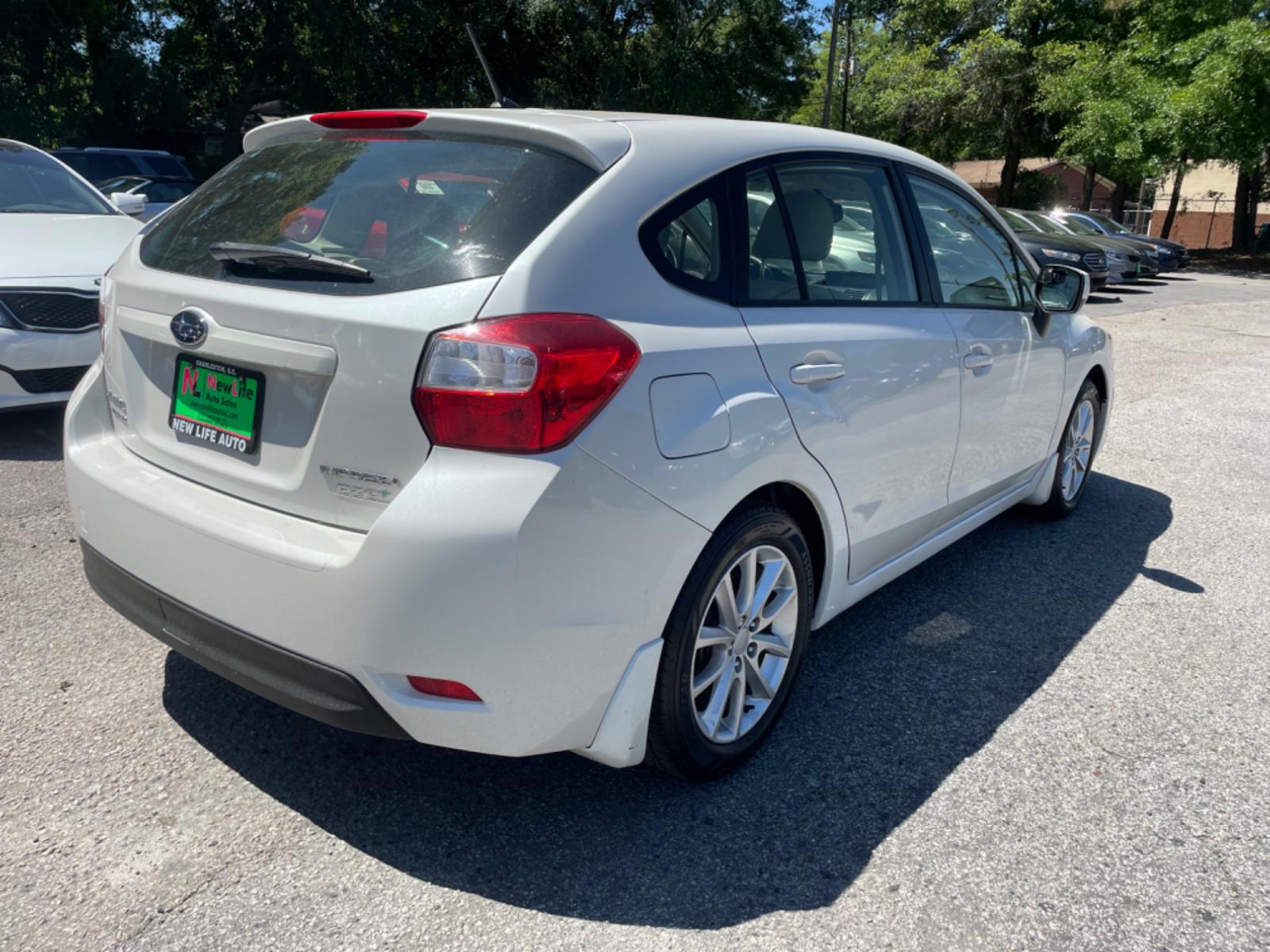 2012 WHITE SUBARU IMPREZA PREMIUM (JF1GPAB67CH) with an 2.0L engine, Continuously Variable transmission, located at 5103 Dorchester Rd., Charleston, SC, 29418-5607, (843) 767-1122, 36.245171, -115.228050 - Photo #6