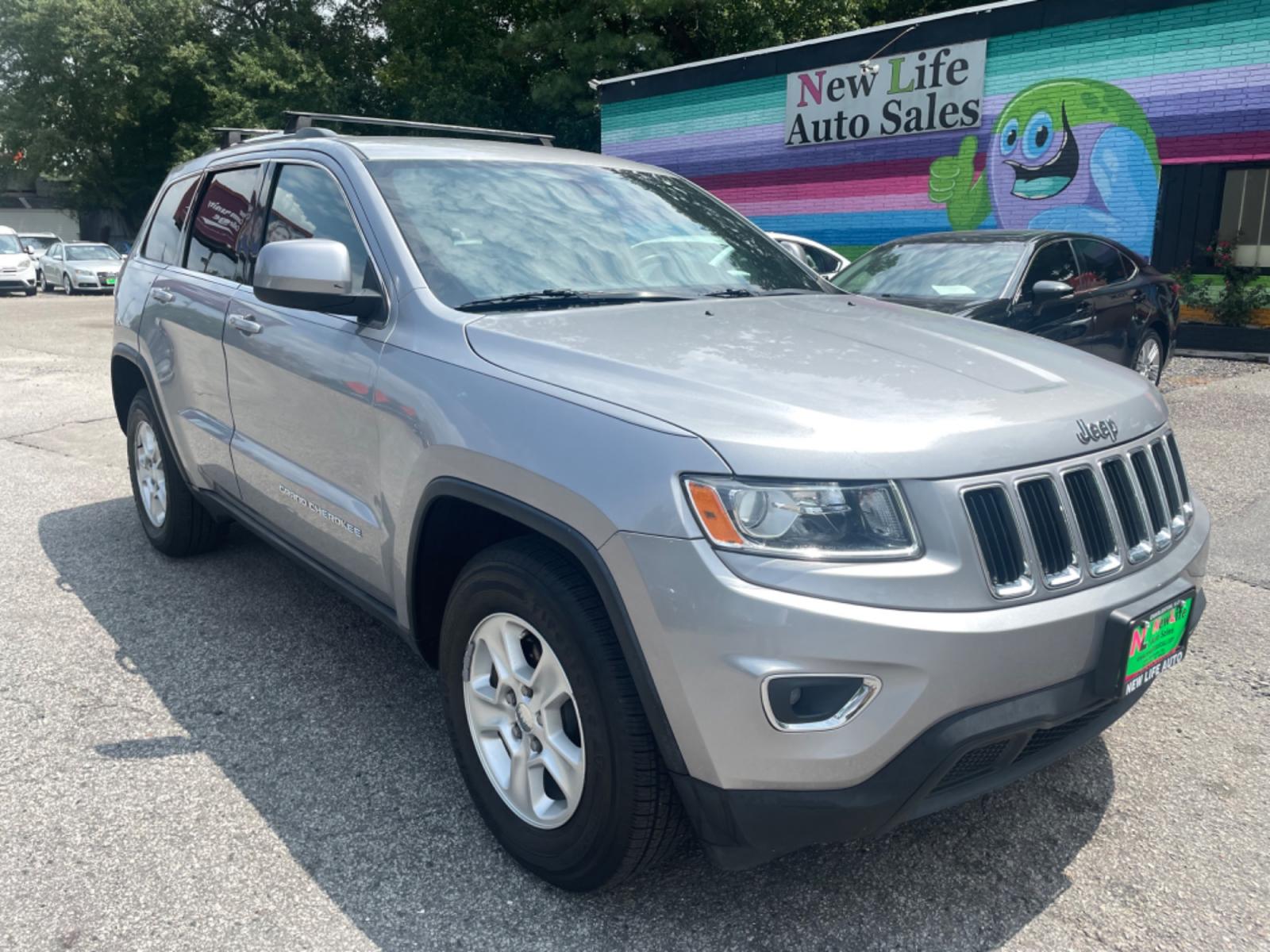2014 SILVER JEEP GRAND CHEROKEE LAREDO (1C4RJFAG3EC) with an 3.6L engine, Automatic transmission, located at 5103 Dorchester Rd., Charleston, SC, 29418-5607, (843) 767-1122, 36.245171, -115.228050 - Super clean interior with AUX/USB/Bluetooth, Power Everything (windows, locks, seat, mirrors), Push Button Start, Keyless Entry, Luggage Rack, Tow Package, Alloy Wheels. 122k miles Located at New Life Auto Sales! 2018-2023 Top 5 Finalist for Charleston City Paper's BEST PLACE TO BUY A USED CAR! 510 - Photo #0