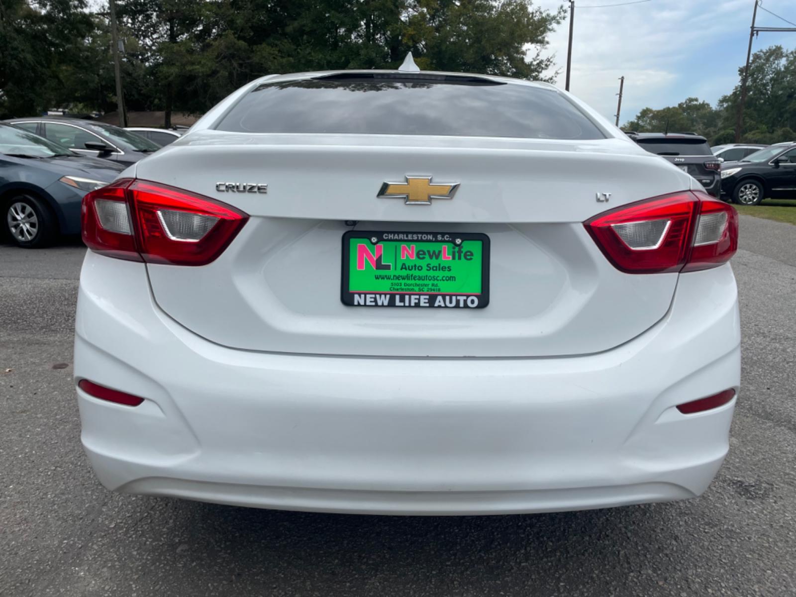 2018 WHITE CHEVROLET CRUZE LT (1G1BE5SM7J7) with an 1.4L engine, Automatic transmission, located at 5103 Dorchester Rd., Charleston, SC, 29418-5607, (843) 767-1122, 36.245171, -115.228050 - Sporty interior with Radio/AUX/USB/Sat/Bluetooth, OnStar, Power Everything (windows, locks, seat, mirrors), Heated Seats, Keyless Entry, Alloy Wheels. 118k miles Located at New Life Auto Sales! 2023 WINNER for Post & Courier's Charleston's Choice Pre-owned Car Dealer AND 2018-2024 Top 5 Finalist fo - Photo #5